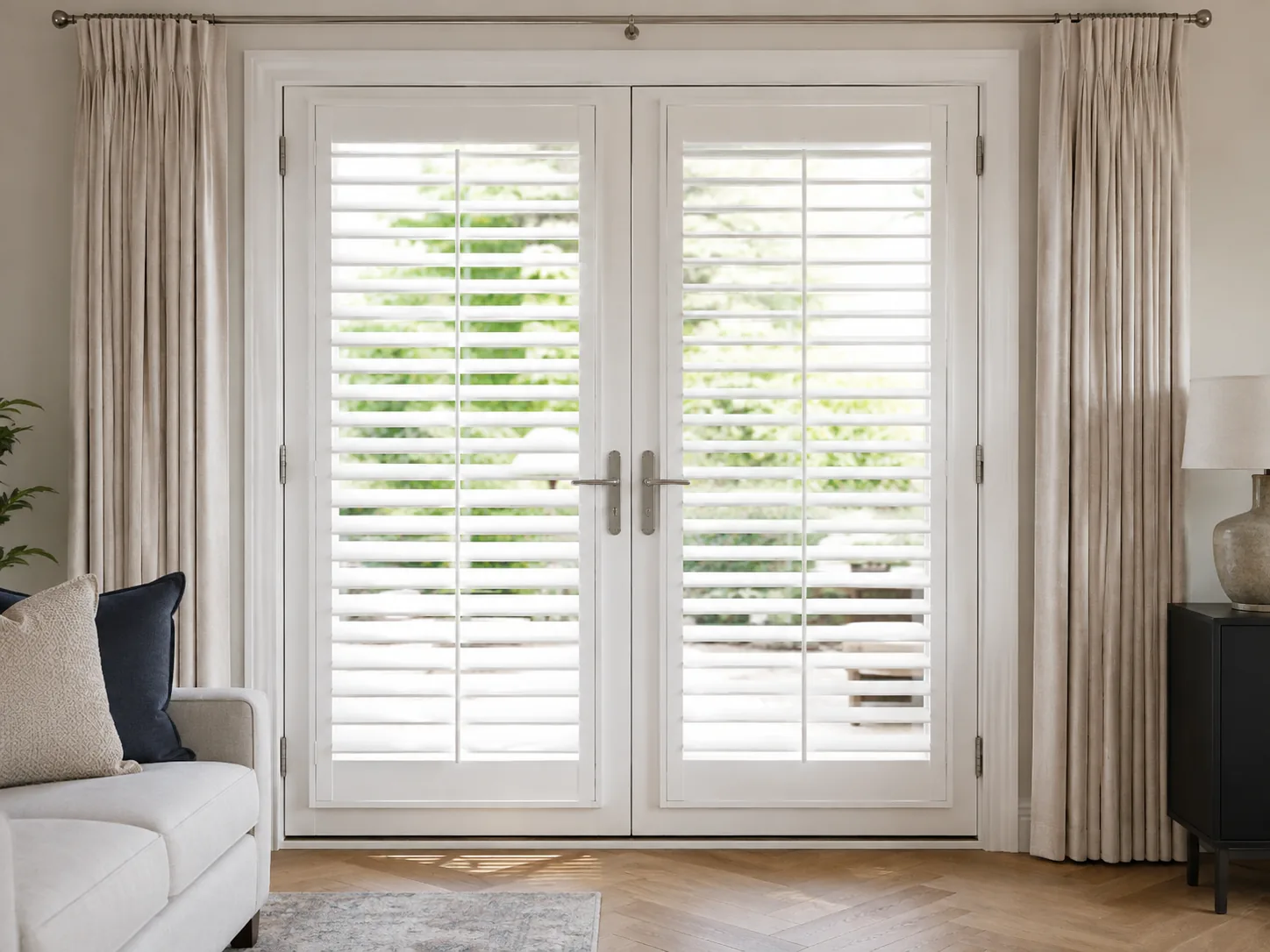 White shutters fitted neatly to glazed French doors in a finished living room