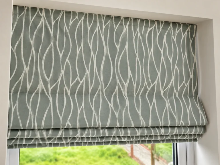 Close view of a patterned Roman blind fitted inside a window recess