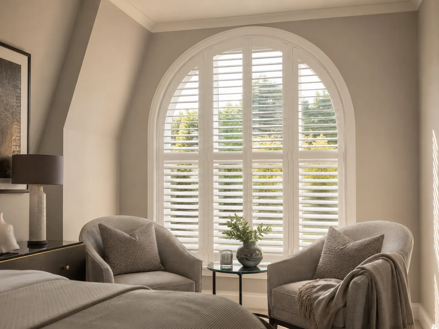 White shutters following the curve of an arched window